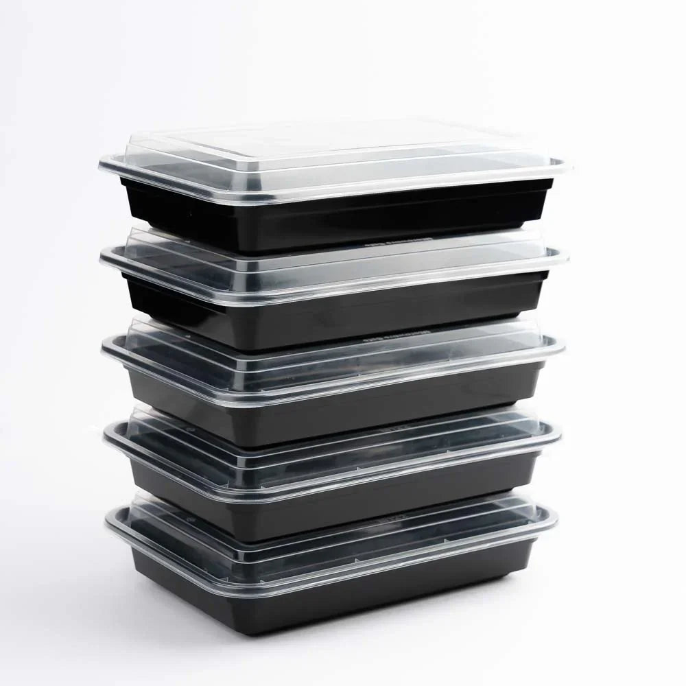 Stack of black plastic food containers with clear lids for restaurant takeaway packaging